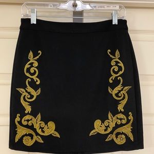Black mini skirt with gold embroidery